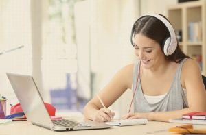 female with headset learning online